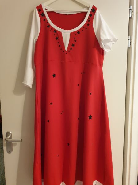 Christmas dress for one armed woman. Red/white with black stars on