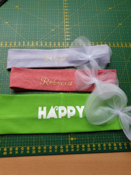 Headbands with text pressed on with HTV